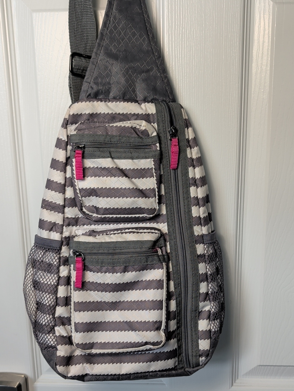 Gray Striped Sling Backpack with Pink Accents